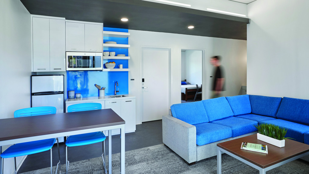 A living room with blue couches.